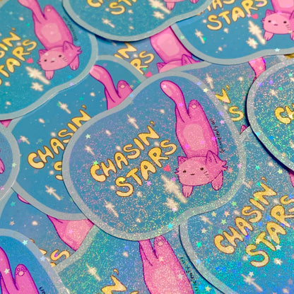 Stickers with 'Chasin' Stars' text and pink cat illustration on a blue background.